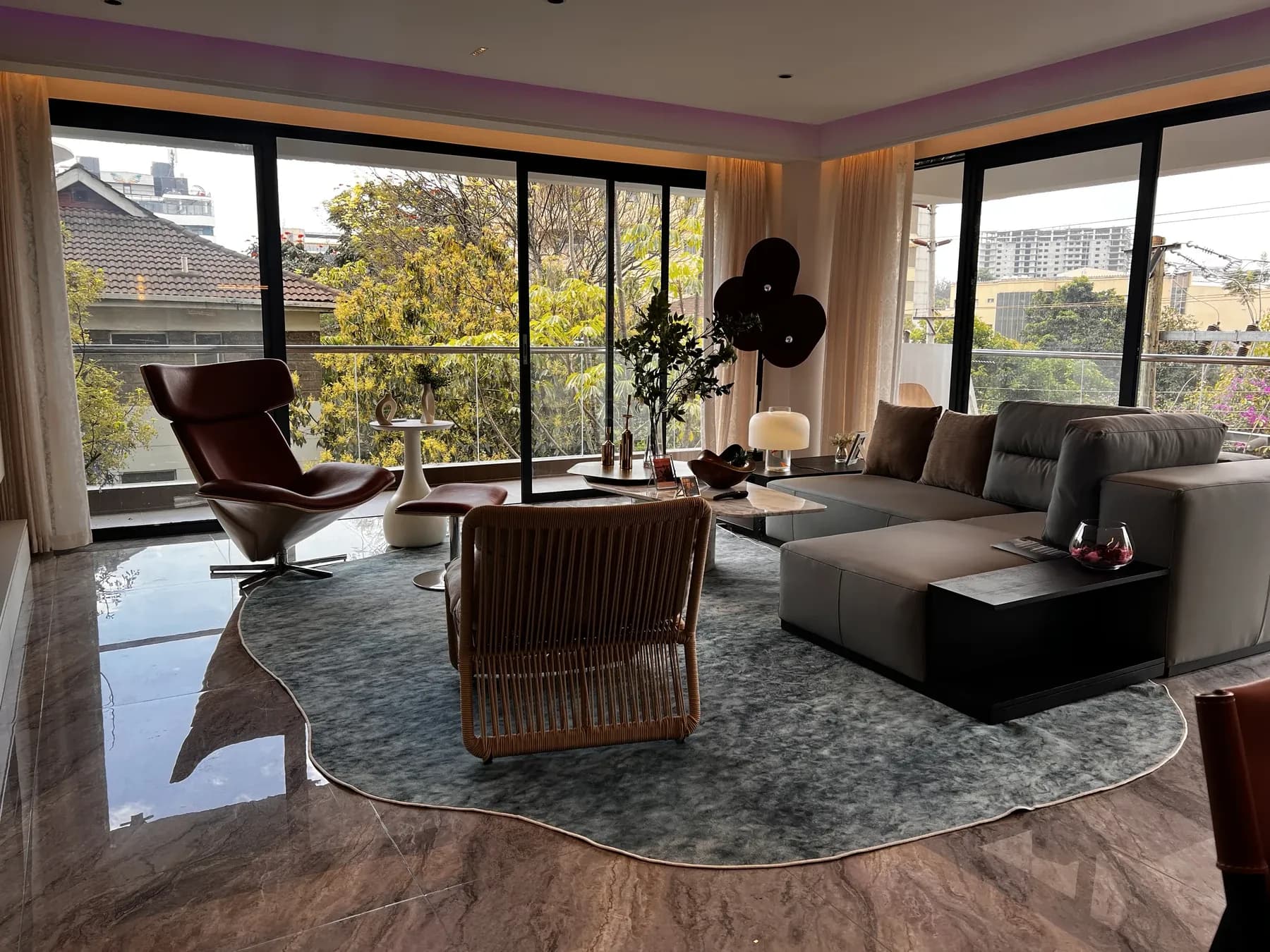 Amani Residence show apartment living area with balcony outlook