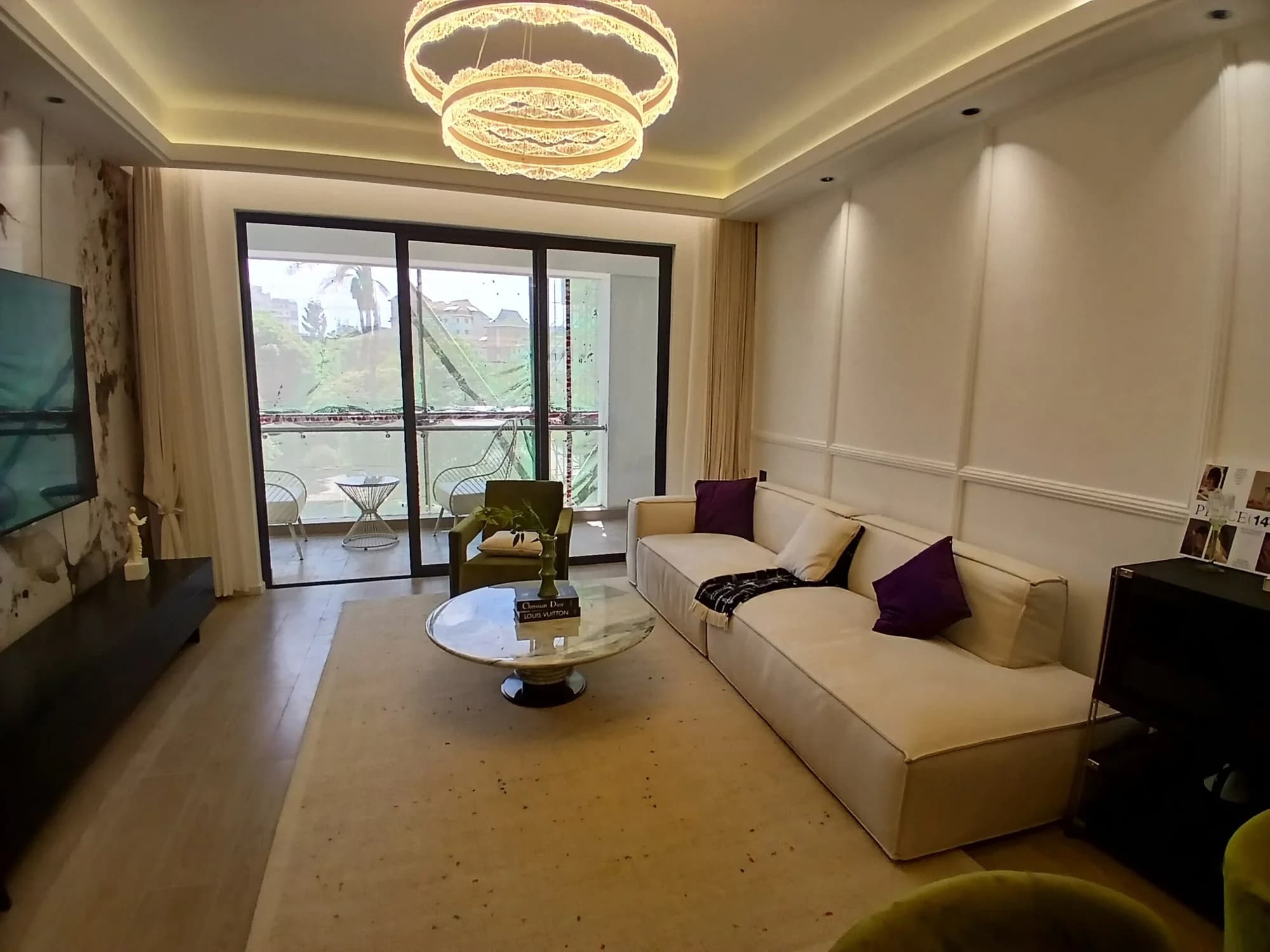 Rendered Capital Heights living area beside full-height balcony doors